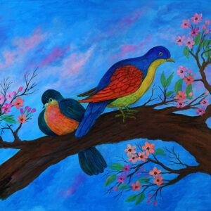 Two coloured birds on a branch of blossoms in a blue background