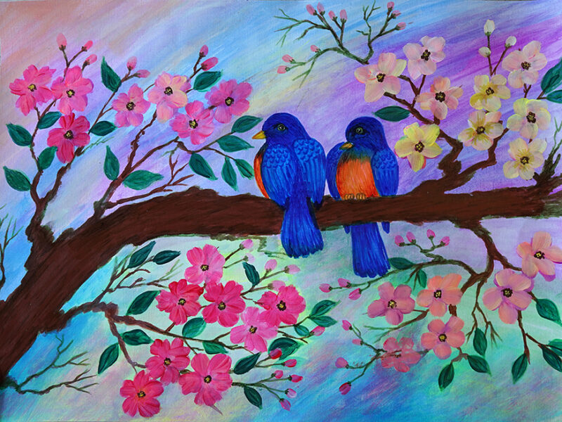 Two coloured birds on a branch of blossoms in a rainbow background